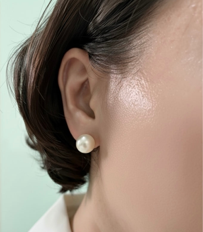 Elegant 12mm Lemony White South Sea Cultured Pearl Earrings in 10K Gold worn by model