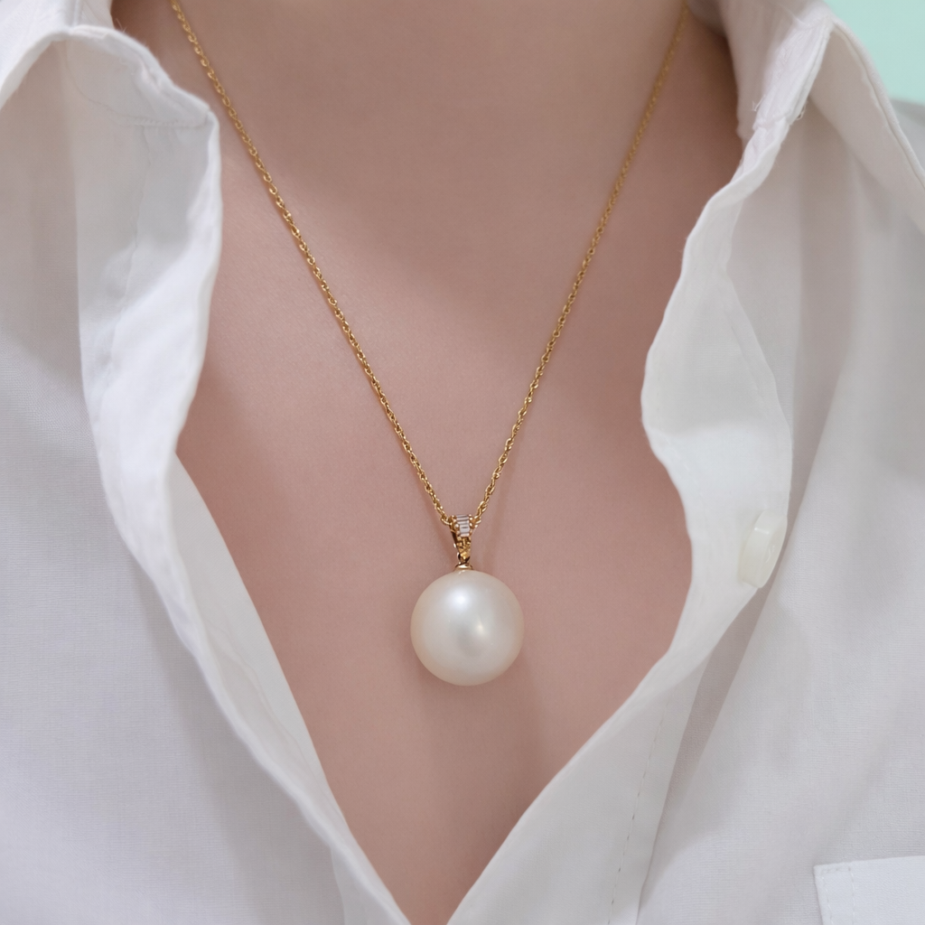 Close-up of 15.7mm Lemony White South Sea Cultured Pearl Pendant with 18K Gold and Diamonds on Model